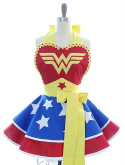 there-are-some-who-call-me-tim:  rosejanenoble:  geekpinata:  Adorable geeky aprons from Bambino Amore. Spotted thanks to Set to Stunning.   Sweet baby jesus  Frilly Wonder Woman apron just got added to my List of Things I Didn’t Know I Wanted Until