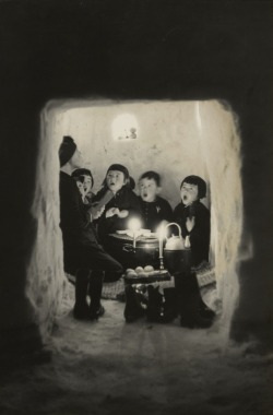 Children singing in a snow cave, 1956.