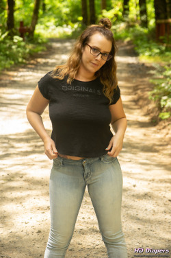 freefetishpics:  Source: HD-Diapers.comBright  sunlight filters through the lush forest canopy, dappling the dirt road  in a symphony of light.  Standing in the middle of that road is Alisha,  teasing us with her cute pull-on style diaper.For this photo