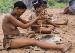 Bushman Women Making Necklaces With Ostrich Eggs Shells, Tsumkwe, Namibia, by Eric Lafforgue.
