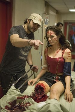 hellyeahhorrormovies:  Robert Rodriguez and Rose McGowan on set of Planet Terror, 2007.