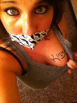 gagged4life:  A gagged selfie with graphoerotica to boot? Bonus points.  &ldquo;Kinky&rdquo;