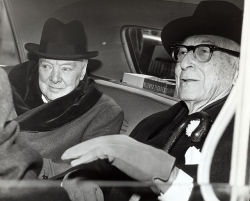Sir Winston Churchill, British statesman, and Bernard Baruch, financier, converse in the back seat of a car in front of Baruch&rsquo;s home.