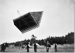 cracked:  Those men are not running in terror from an alien spaceship or a time traveler’s pod arriving from the year 2250. It’s just a tetrahedral kite, developed by Alexander Graham Bell in an attempt to build kites large enough for people to ride
