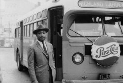 notevenpastuthistory:  Martin Luther King Jr. stands in front of a bus at the end of the Montgomery bus boycott. Montgomery, Alabama December 26, 1956. (Photo Credit: Time &amp; Life Pictures/Getty Images) Martin Luther King Jr is arrested by two white