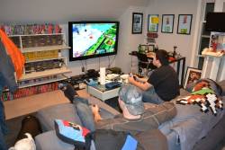 blakat:  killabytes:  Gaming Lounge Redditor ScienceBrah posted this photo set showing his personal trainers (who’ss also a sponsored bodybuilder) gaming room set up which turned out to be quite a sight to behold with the sheer variety of gaming options