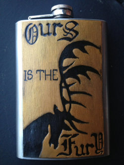 thedrunkenmoogle:  Game of Thrones Carved Flasksby SineCera Represent your favorite house! Steve Barnett has carved the house sigils and words of House Baratheon, Stark, and Lannister onto wood affixed to flasks so that all may know your allegiance. Also