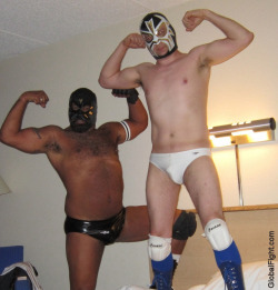 wrestlerswrestlingphotos:  pro wrestlers hotel wrestling guys flexing on bed