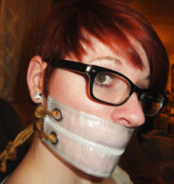 gagged4life:  silent-tight-and-still:  new gag mesh plastic by bunnie3x  Bunnie3x doesn’t get as much love as some other Deviant Art users, but she’s got a wonderful collection of homemade bondage gear, she knows how to play to the camera, and she