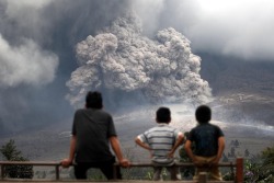 xne:  The indonesian volcano Mount Sinabung erupted again for the third time this year, blowing giant ash clouds into the sky and forcing thousands of locals to flee.    