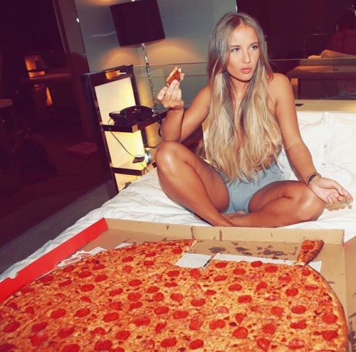 Sexy girl eating pizza
