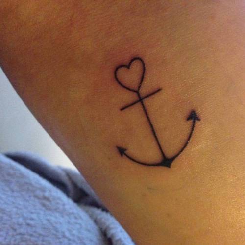Anchor tattoo love conquers all