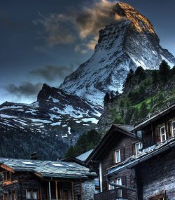 To dwell in the shadow of a giant (Zermatt village, Switzerland, at the foot of the Matterhorn)