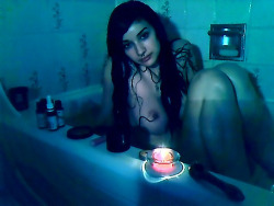 Mygirlfund’s oysterbaby wet and naked in the bath, smoking a pipe in candle light