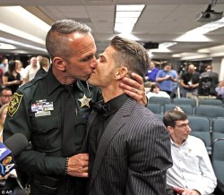 erinmar13:  thehappysorceress:  How to make Florida Republicans cry  -  show them this photo of the first gay couple to legally wed, a sheriff’s deputy and a Marine.  is it wrong that i want the one in the suit to play a batman villian? 