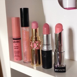 meggygrace:  2014’s Most Worn Lip Products  (L to R) NYX Butter Gloss in “Creme Brûlée”, MAC Dazzleglass in “Sugarrimmed”, YSL Rouge Volupte in “Lingerie Pink”, MAC lipstick in “Creme Cup”, Revlon Lip Butter in “Pink Lemonade”