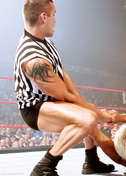 r-keith-blog:  August 11, 2003: Ric Flair locks in the Figure-Four on Goldberg, with Randy Orton as the referee.   Damn that&rsquo;s one hot referee!! O.o