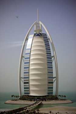 architectureland:  Burj Al Arab is a Luxury hotel located in Dubai, United Arab Emirates. At 321 m, it is the fourth tallest hotel in the world. Burj Al Arab stands on an artificial island 280 m from Jumeirah beach and is connected to the mainland