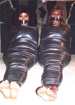 plastic-wrapped-girls:  Pic downloaded in 1999 from www.archway-to-monica.com. 