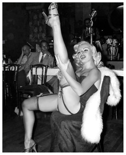 burleskateer:Rita Grable kicks up a shapely leg, during a performance at an unidentified 50’s-era nightclub..