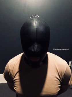 seabondagesadist:  Boundtight85 found his way into my straightjacket for a nice afternoon of captivity. A few hours strapped in, hooded, gagged, muzzled and locked to the post.   First I used cuffs as a placeholder to get him properly hooded and gagged.