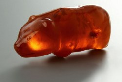 sixpenceee:  Amber Bear Amulet: 3500 Years OldIt was found in 1887 in a peat bog near Slupsk, Poland. When the figure was examined it turned out to be the amulet of a bear hunter, originating from the Neolithic period