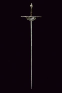 art-of-swords:  Cup-hilted Rapier Dated: 17th century Culture: Spanish Measurements: overall length 123 cm The sword features a thin blade of lozenge section, the first part featuring a groove at the center and a small tang. The iron hilt has a wide,