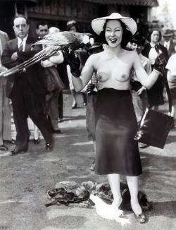 An astonishing Press Photo from May of &lsquo;39.. It features a bare-breasted Yvette Dare, losing part of her dress; on the fairgrounds of the 'New York World&rsquo;s Fair&rsquo;.. Her press agent contrived the publicity stunt to promote her upcoming