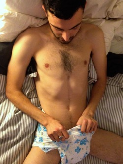 wetscruff:  What started off as just another Saturday night, ended up with him in diapers for the first time.  Pretty awesome how totally into it he is now.  We def have a new convert  ^_^  This guy is so hot!!!