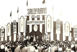 Sally Rand poses with the entire cast from her 1952 travelling Burlesque show, entitled: &ldquo;Happy Holiday&rdquo;.. Touring across the Carnival circuit, the show was themed around the idea of a nautical cruise ship stopping in on various International