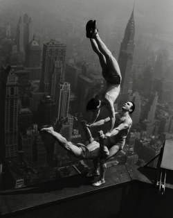 Acrobats Jarley Smith (top), Jewell Waddek (left), and Jimmy Kerrigan (right) perform a delicate balancing act on a ledge of the Empire State Building in Manhattan, 1934.