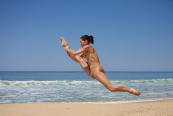 Dancer training on nude beach.