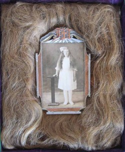 Photograph of Mary H. Helgeson surrounded by her actual hair. 1930.