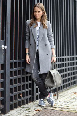 justthedesign:  Street Style, November: Vanja Milicevic is wearing sneakers from Adidas, faded jeans, T-Shirt and structured grey coat from Zara, and the bag is from DKNY
