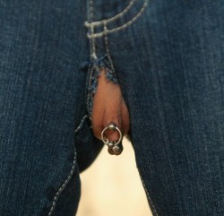 Nicely pierced pussy protruding cheekily through ripped jeans!