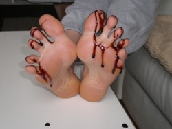 femdomgames:  Pour some chocolate sauce over your feet and make him lick them clean. If he does a good job he gets to lick your pussy.