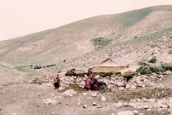 oldafghanistan:  Title: Life As Nomads Description: Members of a Nomad Family gather outside their Home atop a cliff in the Band-E-Amir. Location: Band-E Amir, Bamiyan, Central Afghanistan.  Circa: 1971 