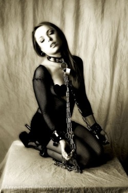 the photographer and the model make this work, even though it is so clearly posed&hellip;..what makes it work is the tilt of her head and the look on her face&hellip;..not the heavy chains&hellip;&hellip;all the restraints are just symbols&hellip;..real