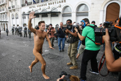 maleinstructor:  A naked protester runs through Syntagma Square by the parliament in Athens during a violent protest against the visit of Germany’s Chancellor Angela Merkel October 9, 2012 