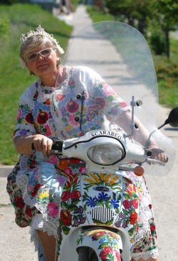 sartorialadventure: jamsker:  peterfromtexas: Born to be wild The lady on the scooter was an artist named Szabó Éva (sadly she passed away 4 years ago). She decorated the scooter herself, and as far as I know she could have embroidered the dress herself