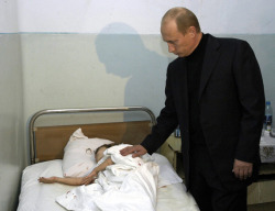 thivus:  rare image of vladimir putin absorbing the life force of a small child 