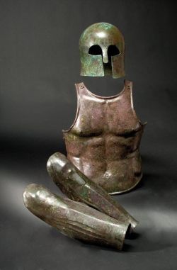 treasures-and-beauty:  Greek set of armour: a Corinthian helmet, 7th century B.C., a muscle armour breastplate, 5th century B.C. and a pair of greaves, 5th century B.C.E. 