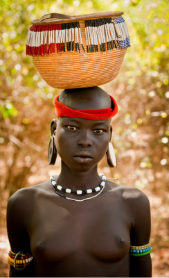 areyoustrange:  a—fri—ca:  Mursi girl, Ethiopia - Photo by Gerry Andrews The Mursi (or Mun as they refer to themselves)  are a Nilotic pastoralist ethnic group that inhabits southwestern Ethiopia.  Surrounded by mountains between the Omo River