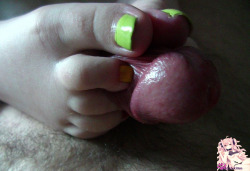 ticklish-kitten:  Playing around with my favorite toy , it make my master really excited and horny when i squeeze his big glans between my toes and stretch his lovely foreskin X3