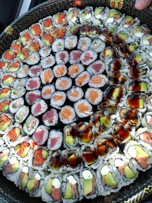 sushioverload:  can anyone guess how much this round tray of sushi cost?