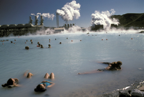 unrar:Swimmers in a therapeutic thermal lake created from a power plant, Blue Lagoon, Iceland by Richard Nowitz.