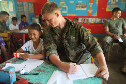 girlintherubyslippers:           Marine pretending to cheat off a 4th graders math exam. - Phillippines  This is kind of adorable.  this deserves every single note and then more.  holy moly this is the cutest thing ive ever seen  AWWWWWWW  This is the