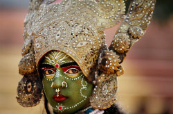 A woman dressed as Kali, a Hindu goddess, in a procession before the Shivratri Festival in Jammu, India 