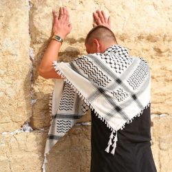 girlactionfigure:  Only in Israel. A man wearing a Palestinian kuffiyeh (Arab headdress) goes to pray at the Jewish holy site: the Western wall. The reaction of the Jews praying around him? Nothing.   Photo: David Abitbol  standwithus  