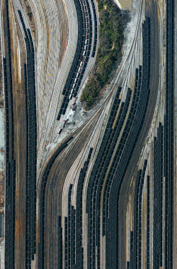 dailyoverview:  Train cars filled with coal are stationed in Norfolk, Virginia. Operated by the Norfolk Southern corporation, Lamberts Point Pier 6 is the largest coal-loading station in the Northern Hemisphere and serves at the temporary depot for the